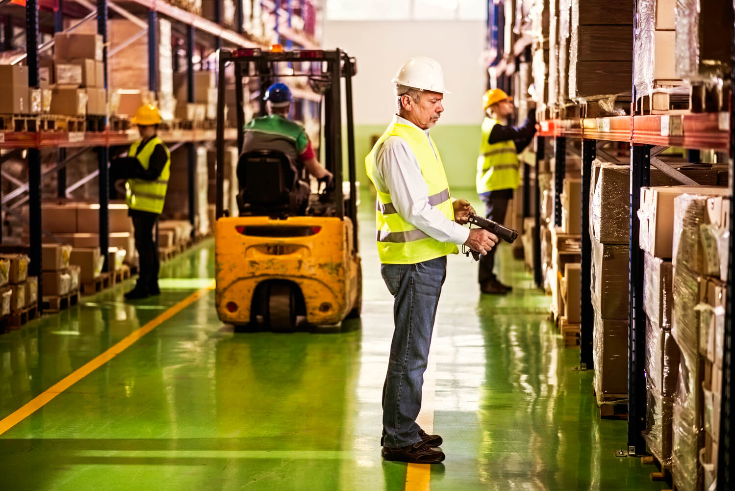 Warehouse Employee Scanning Boxes